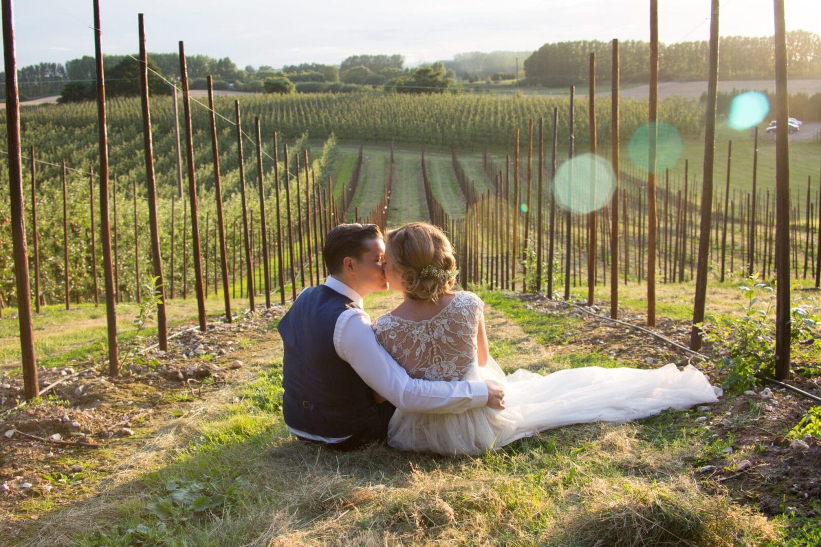 Bride and groom in The BarnYard orchards at golden hour