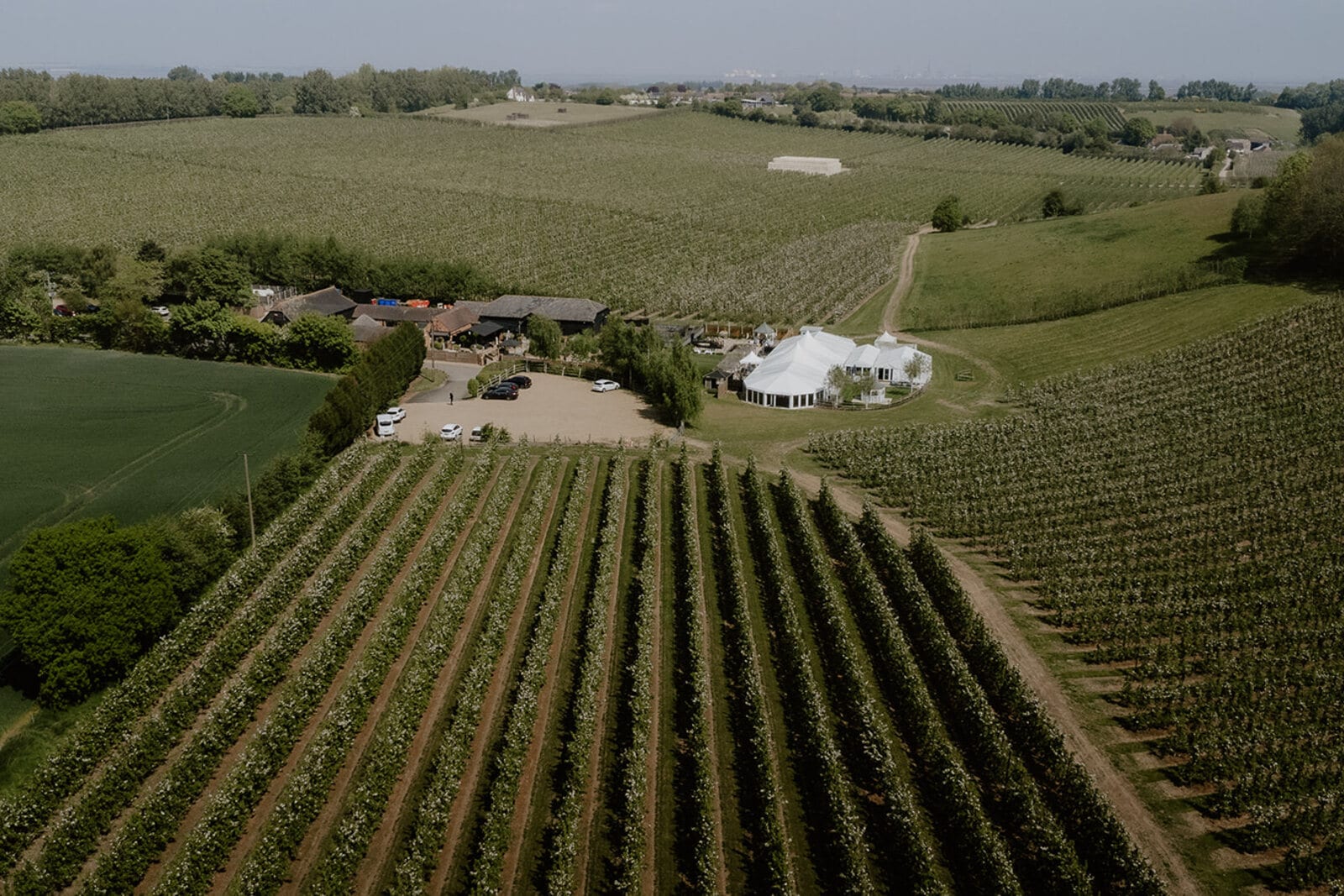 Aerial view of The BarnYard in 150 acres of Kent orchard