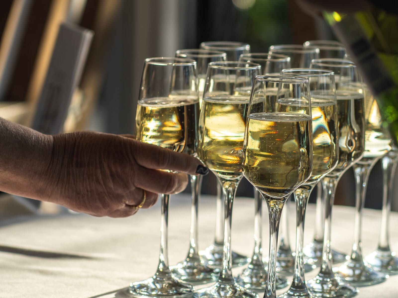 Champagne poured for a summer party at The BarnYard