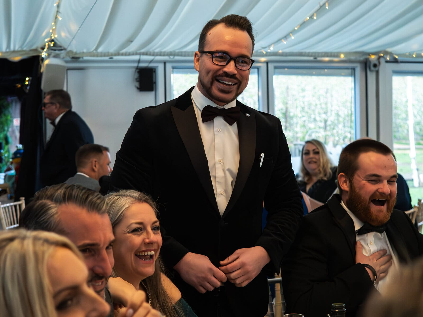 A toast at a private dinner in the pavilion at The BarnYard