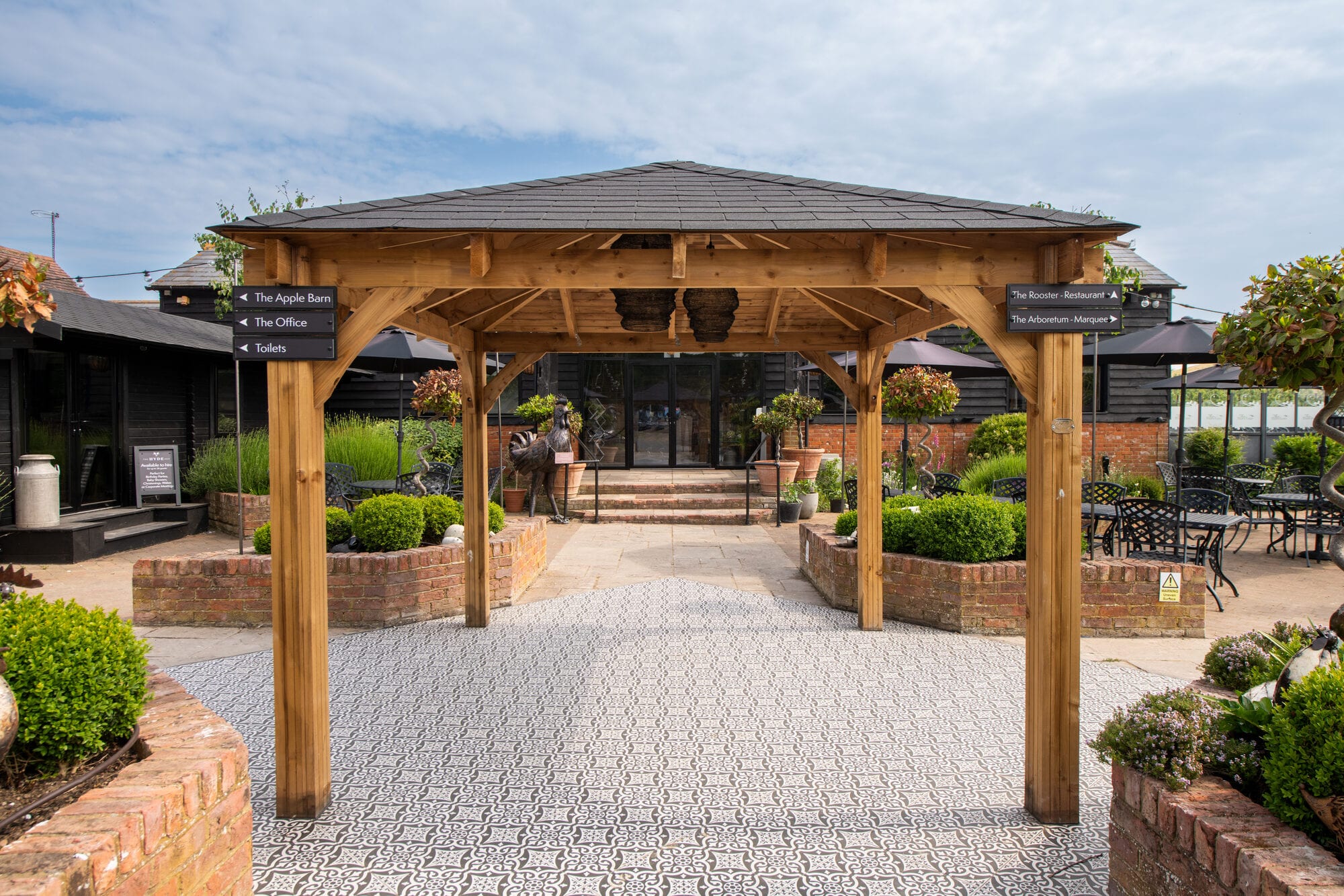 The covered patio at The BarnYard, set for relaxed outdoor dining