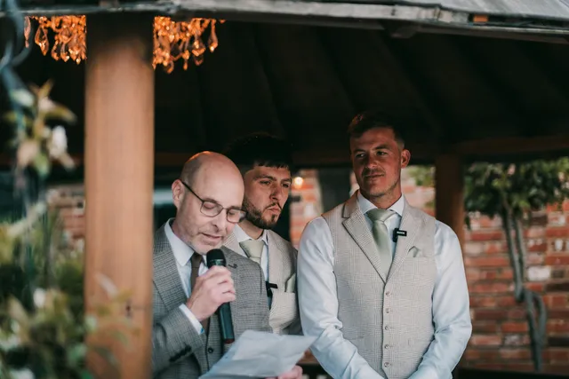 A best man gives his speech at a wedding reception