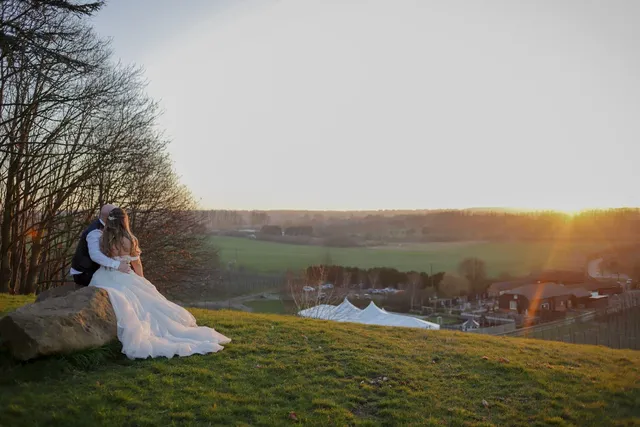 A bride overlooking the venue from the hill