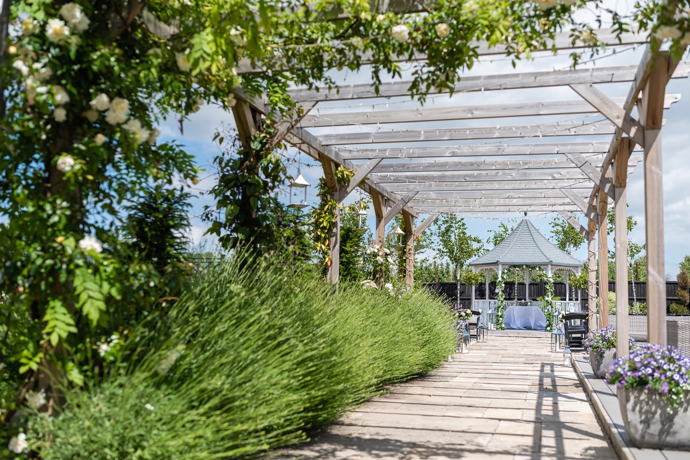 The Lavender Walk gazebo at The BarnYard set for an outdoor ceremony
