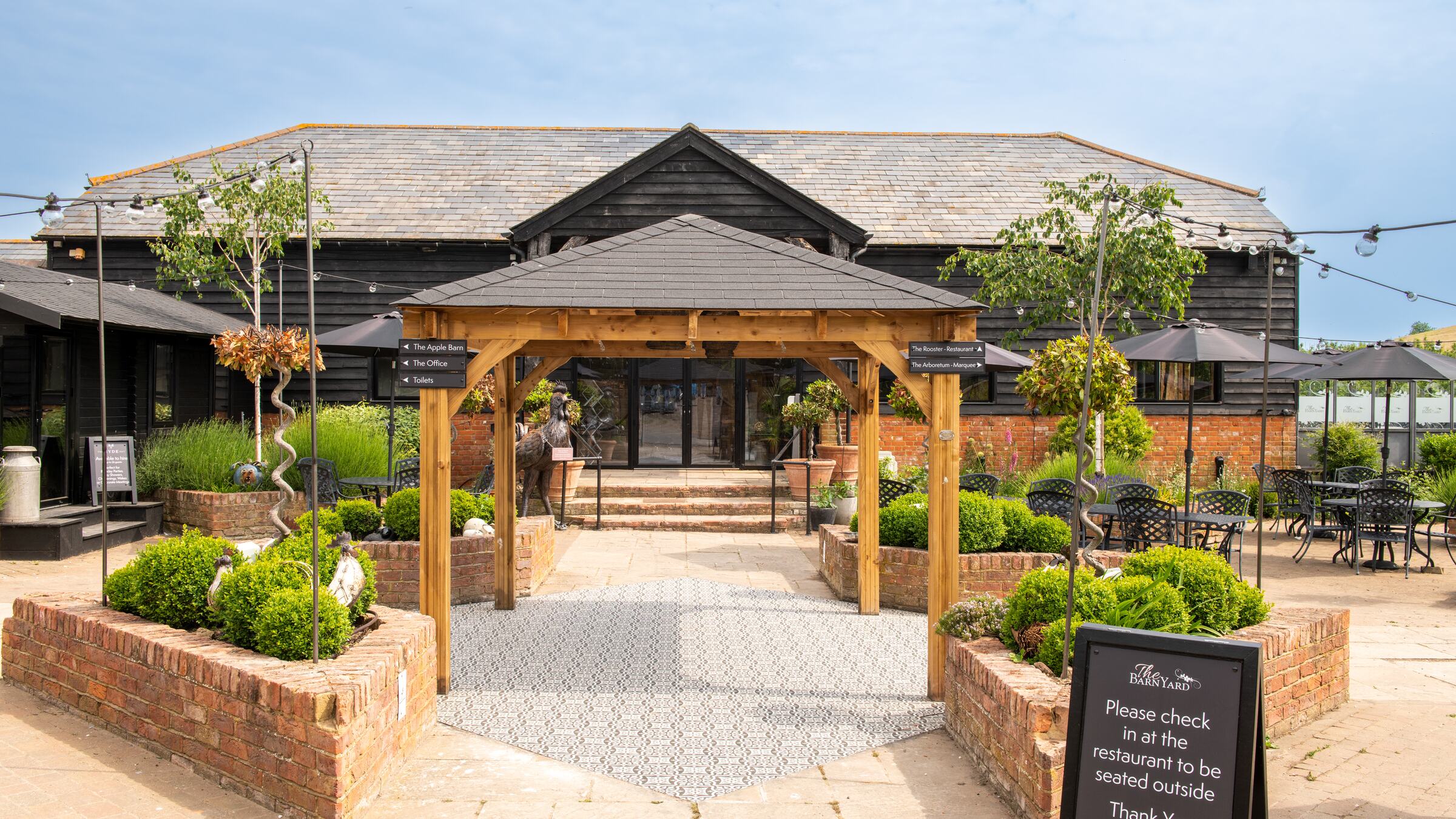 The oak pergola and courtyard entrance to The Rooster at The BarnYard in Kent, the kind of day a gift voucher gives