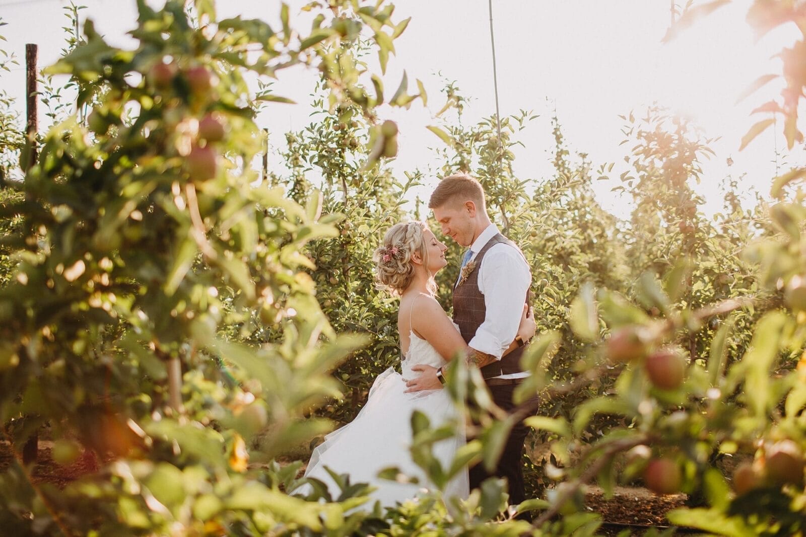 Newlyweds in the orchard at The BarnYard